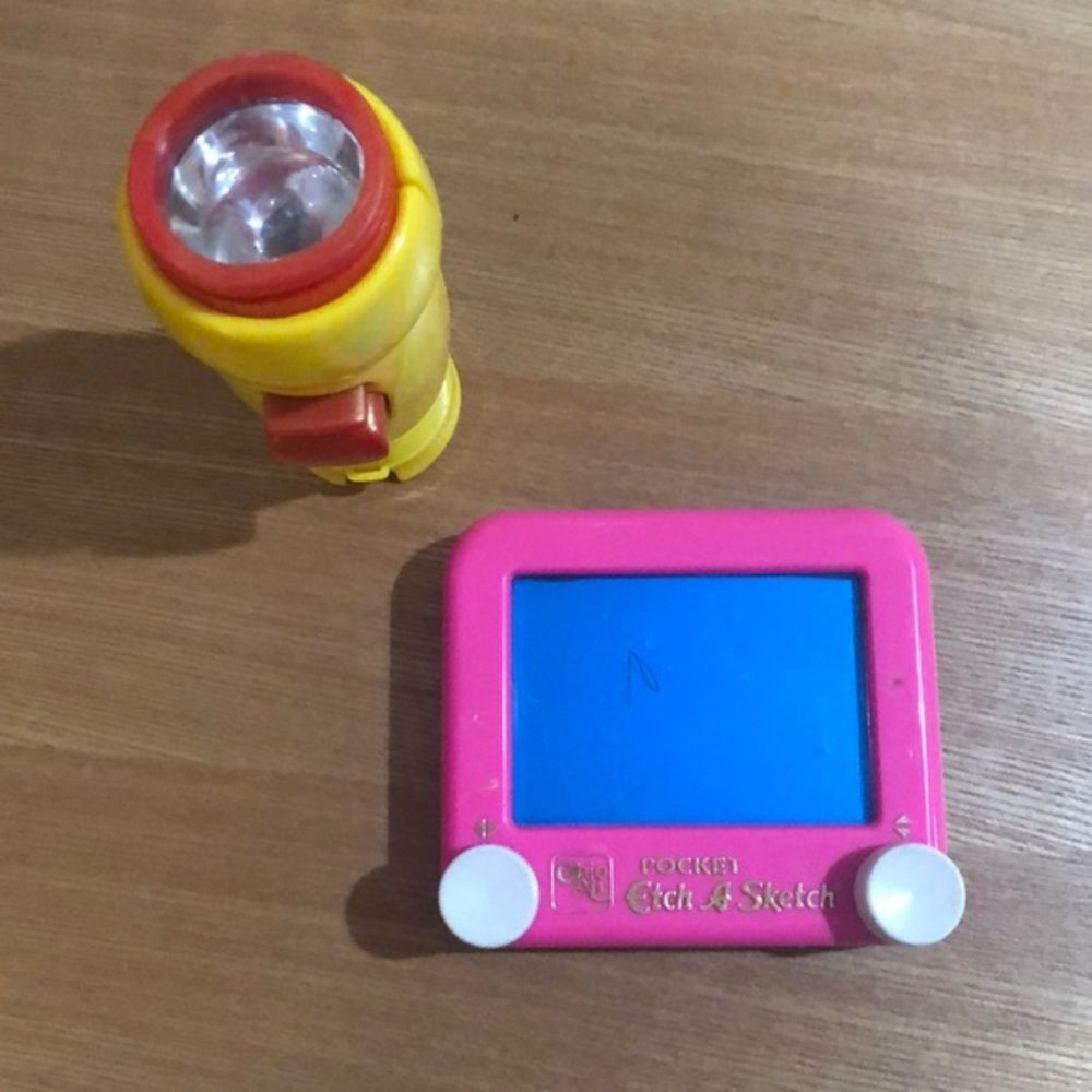 Flashlight that moos as you push the button and a pink etchasketch